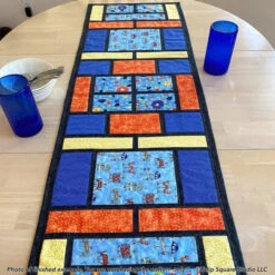 Picture Windows Table Runner Downloadable Pattern -Qbpn 599 picture window runner 02 tulip square quilt patterns 600x600 1